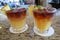 Pair of mai tai cocktail beverages with pineapple garnish at a bar in Kona, Hawaii