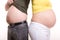 Pair, man and woman compare their belly