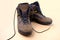 Pair of men`s trekking boots made of natural brown suede with modern technological materials, the concept of special shoes for