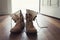 Pair of men\'s worn leather boots in doorway of home