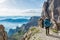 Pair of mountaineers walking a mountain path.