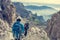 Pair of mountaineers walking a mountain path.