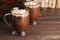Pair of Mugs Filled with Hot Chocolate and Marshmallows on a Woo