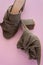 Pair of mules/clogs on pink background