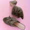 Pair of mules/clogs on pink background