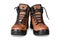 Pair of new modern high brown leather hiking boots isolated on white background. Two trekking rough warm winter footwear