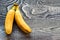 Pair ofnanas on wooden background