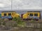 A pair of Old Dutch urban Commuter Train Drivers Cabins parked on the Quayside at Den Haag Container Port.