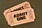 Pair of old torn admit one movie tickets