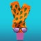 A pair of orange socks with a pattern of cacti, growing out of a pink flowerpot, beside sunglasses, a funny vacation and travel