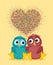 Pair owls in love. Vector. Colorful confetti in the form of heart