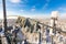 Pair of protective gloves of worker-climber is on the top of telecommunication tower with vertical panel antennas and