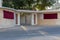 A Pair of Qatar flags proudly hang on the wall of a residential entrance way in Doha, Qatar