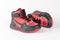 A pair of red and black kids sneakers. Children`s shoes