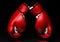 A pair of red boxing gloves,l on reflective