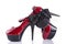 Pair of red female shoes with hair fascinator