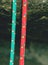 Pair of red and green climb ropes in detail. Used light rope