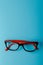 pair of red plastic-rimmed eyeglasses