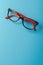 pair of red plastic-rimmed eyeglasses