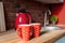 Pair Red polka dot retro vintage coffe tea mugs on wooden kithen counter at rustic room interior on breakfast time. Two