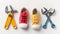 A pair of red and yellow canvas shoes flanked by colorful wrenches on a white background, showcasing a playful juxtaposition of