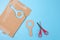 a pair of scissors sitting on top of blue surface, cut out of cardboard, magnifying glass shape, tutorial,