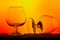 Pair of silhouetted cognac glasses on gradient background