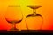 Pair of silhouetted cognac glasses on gradient background