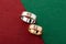 Pair of silver mens ring and pink gold womens ring decorated with tree on contrast green and red background