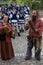 A pair of singers in medieval clothes playing their old songs