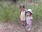 A Pair of Sisters Embrace Among the Cattails