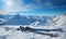 Pair of skis in snow with copy space. skis standing in snow with winter mountains in background. Winter holiday vacation