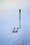 Pair of skis and sticks stuck in snow during the winter storm