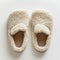 Pair of Slippers Resting on White Surface