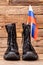 Pair of soldier army boots and flag of russia.