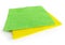 Pair of square yellow and green cloths isolated on white background. Multipurpose anti-bacteria cleaning rag and dust trap. Close