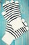 Pair of striped womanly gloves for autumn or winter