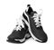 Pair of stylish modern training shoes on white