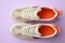 Pair of stylish shoes on lilac background