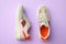 Pair of stylish shoes on lilac background