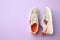 Pair of stylish shoes on lilac background. Space for text