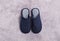 Pair of stylish slippers on light grey carpet, top view