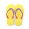 Pair of stylish yellow flip flops isolated, top view. Beach object