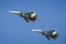 A pair of SU-34 aircrafts perform demonstration flights in the sky over a military training ground