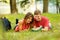 Pair successful students with a textbook in a Park