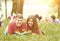 Pair successful students with a textbook in a Park