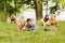 Pair successful students with a textbook in Park on a Sunny day