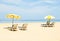 Pair of sun loungers and a beach umbrellas on the beach