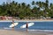 A pair of surfers look towards the point break waves at Arugam Bay in Sri Lanka.