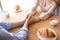 Pair of sweethearts holding hands during romantic date at cafe, enjoying lunch, drinking coffee, closeup